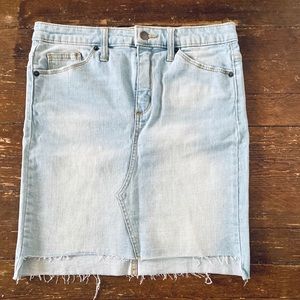 NEVER WORN. Light wash mini skirt.